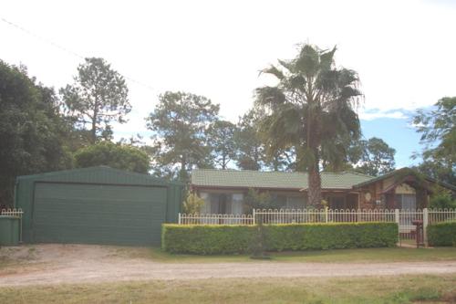 LIVE ON RUSSELL ISLAND IN THIS LOVELY BRICK HOME WHILST EARNING AN INCOME!