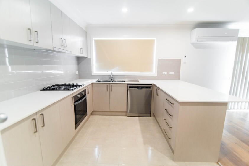 Open plan 2 bedroom unit including lock-up garage