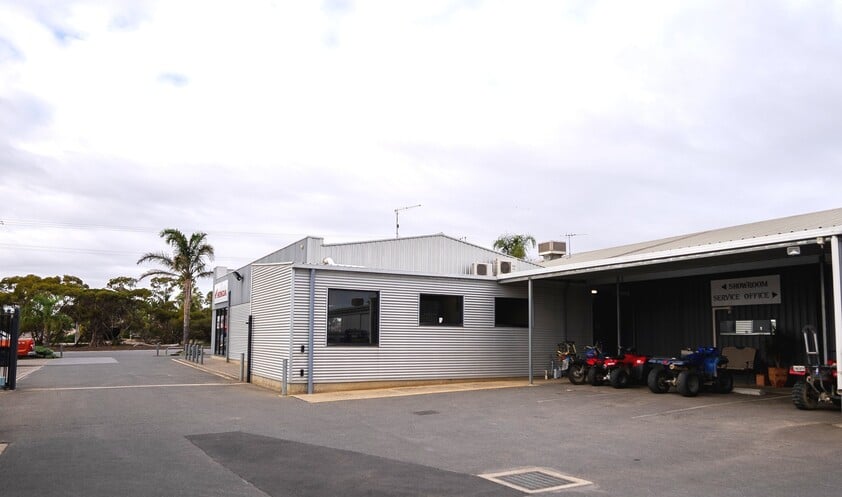 FREEHOLD PREMISES IN PROMINENT POSITION WITH SOLID MOTORCYCLE DEALERSHIP BUSINESS