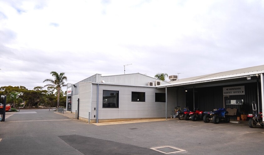 FREEHOLD PREMISES IN PROMINENT POSITION WITH SOLID MOTORCYCLE DEALERSHIP BUSINESS