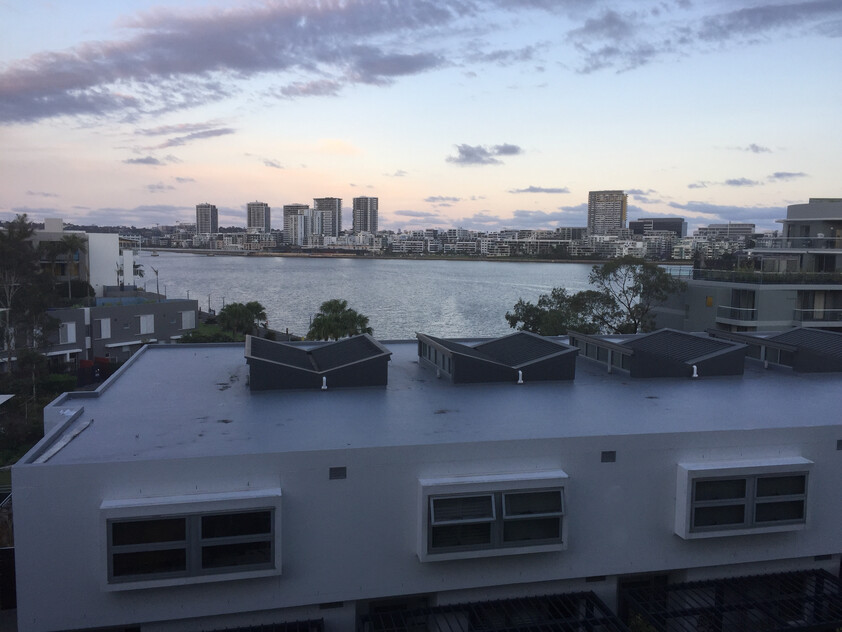 Rare Fully Furnished Apartment in resort style cul-de-sac living in private bayside residence with uninterrupted sparkling water views