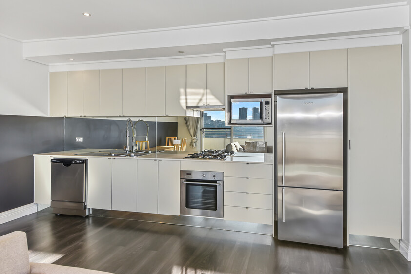 Rare Fully Furnished Apartment in resort style cul-de-sac living in private bayside residence with uninterrupted sparkling water views