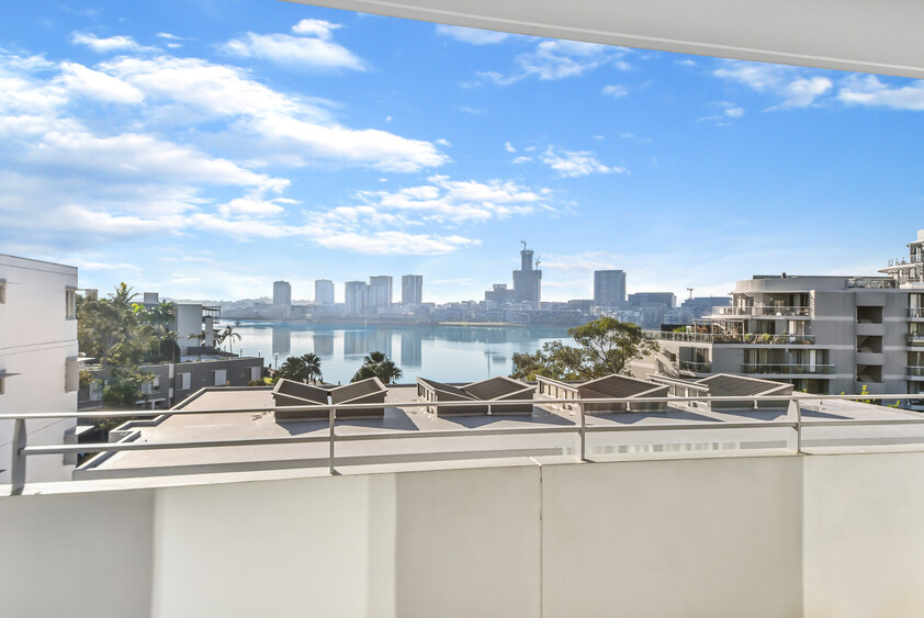 Rare Fully Furnished Apartment in resort style cul-de-sac living in private bayside residence with uninterrupted sparkling water views