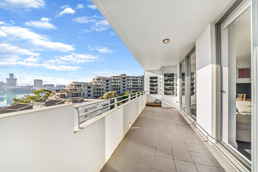 Rare Fully Furnished Apartment in resort style cul-de-sac living in private bayside residence with uninterrupted sparkling water views